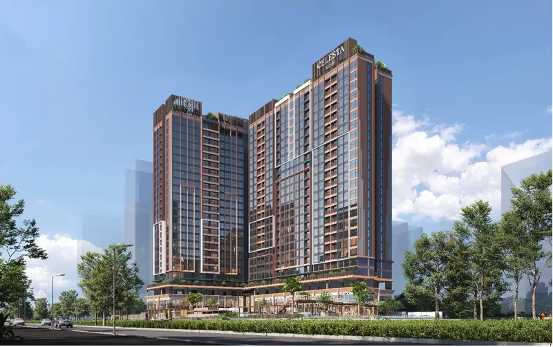 Phối cảnh Celesta Gold nhìn từ góc thấp, mặt đứng kính và khung màu đồng dưới trời xanh