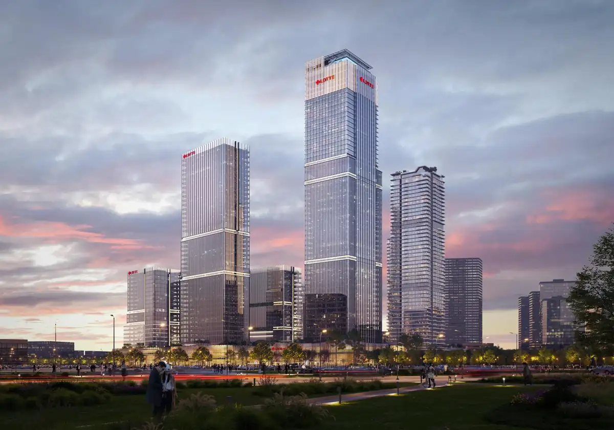 Phối cảnh các khối tháp Lotte Eco Smart City lúc hoàng hôn nhìn từ công viên bờ sông
