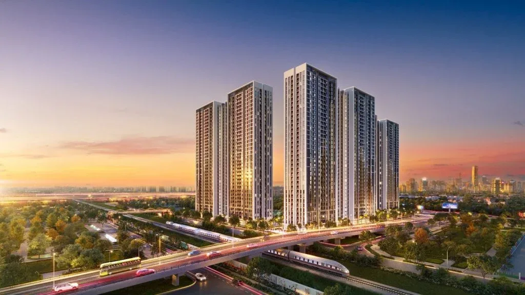 Cụm tháp căn hộ Imperia Smart City lúc hoàng hôn, tuyến metro trên cao chạy phía trước