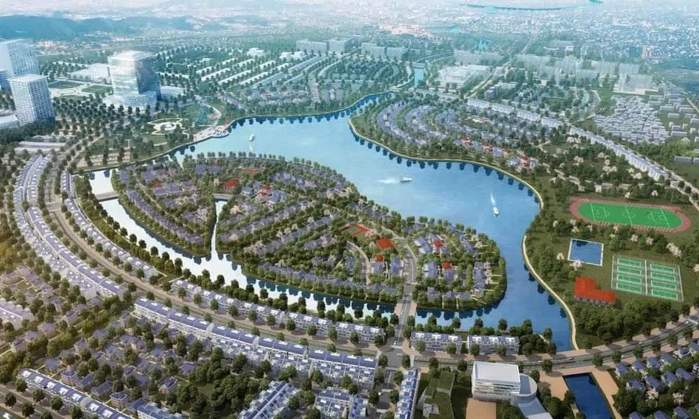 Phối cảnh toàn khu đô thị nhìn chếch, dòng sông chạy vòng quanh lõi cây xanh ở giữa