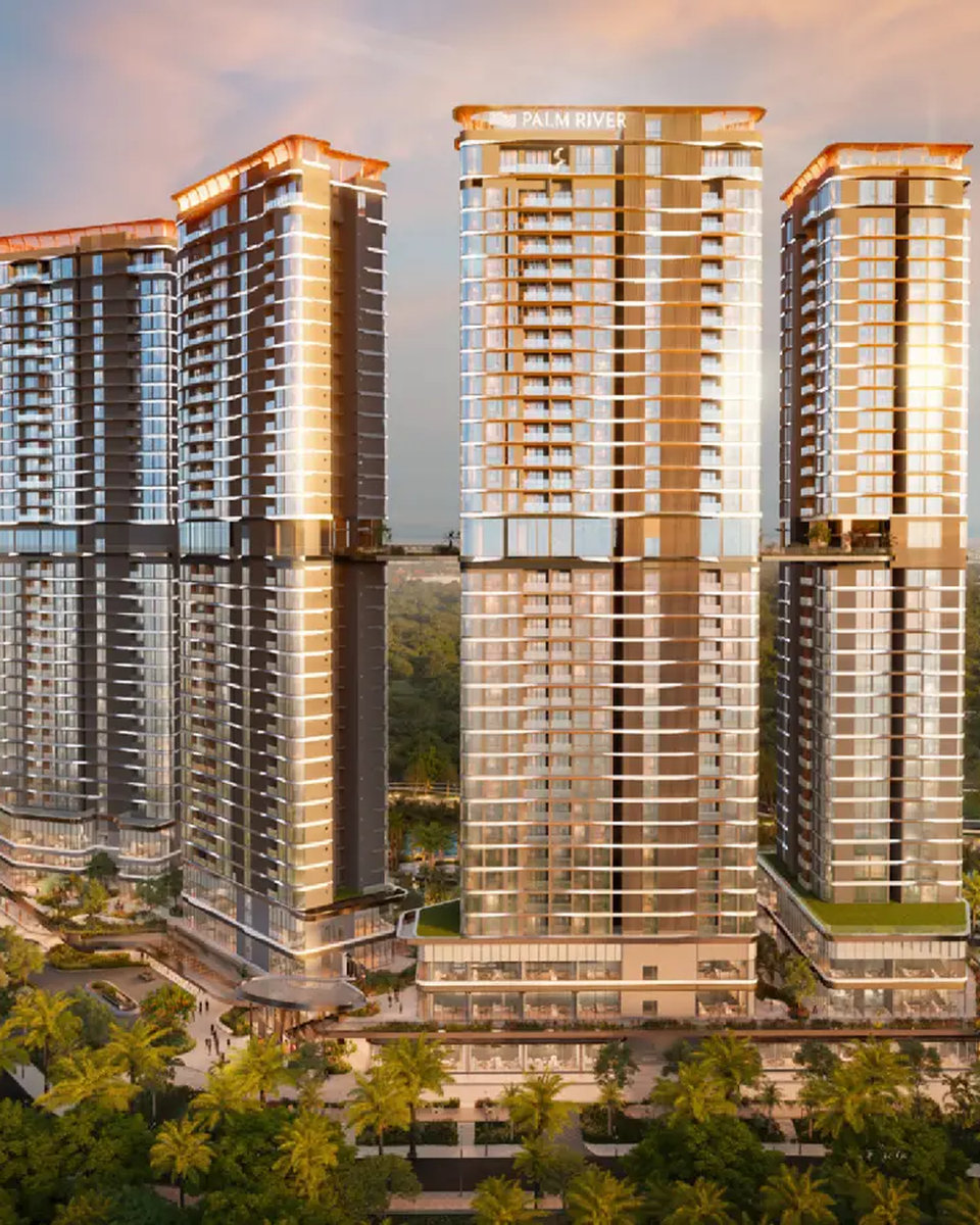 bốn tháp căn hộ palm river với logo dự án trên đỉnh tháp lúc hoàng hôn
